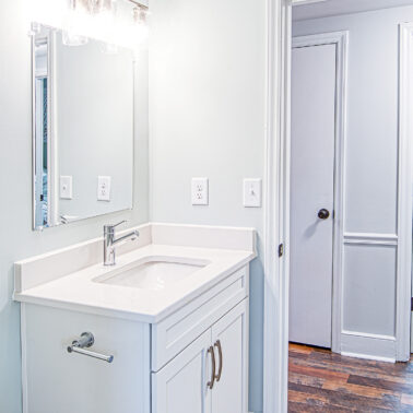 Custom bathroom renovation with modern vanity and lighting in Charlotte, NC