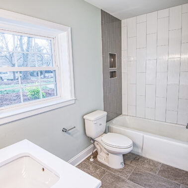 Custom bathroom renovation with modern vanity and lighting in Charlotte, NC